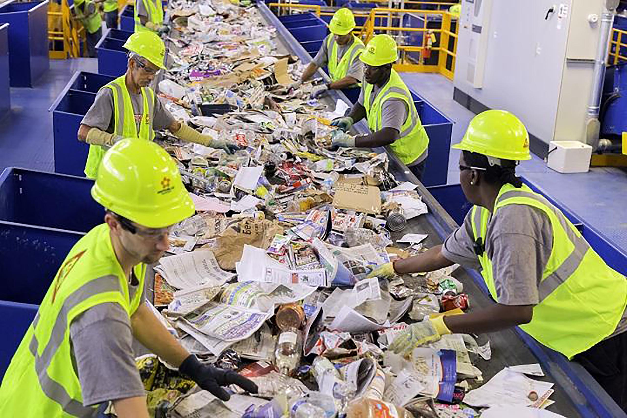 Industrial waste sorting line separating plastic, paper and metal materials for recycling